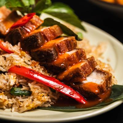 Marinated crispy pork belly with fried rice.