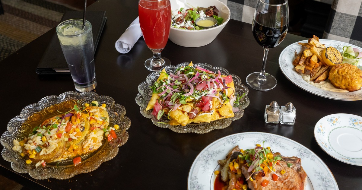 Dining table filled with entrees and drinks