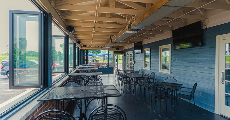 Exterior, patio, tables and chairs lined up