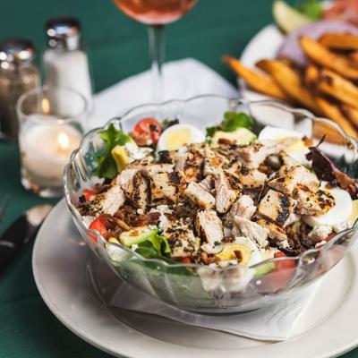 Cobb Salad, with grilled chicken, tomato, bacon, egg, avocado, and blue cheese crumbles.