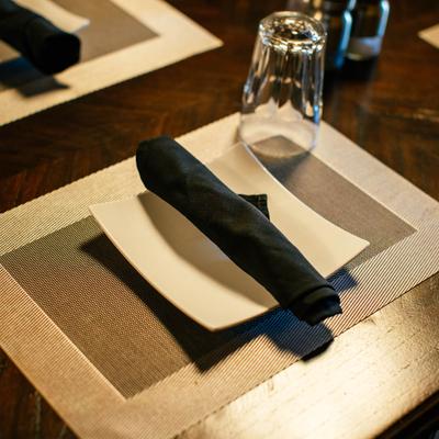 Plate, napkin, and a glass.