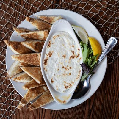 Jumbo lump crab dip served with grilled bread points, top view.