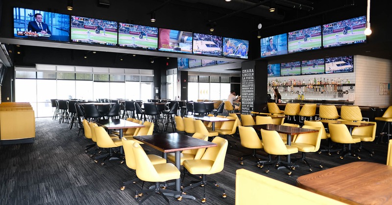 Interior, wide view, tables and yellow leather chairs