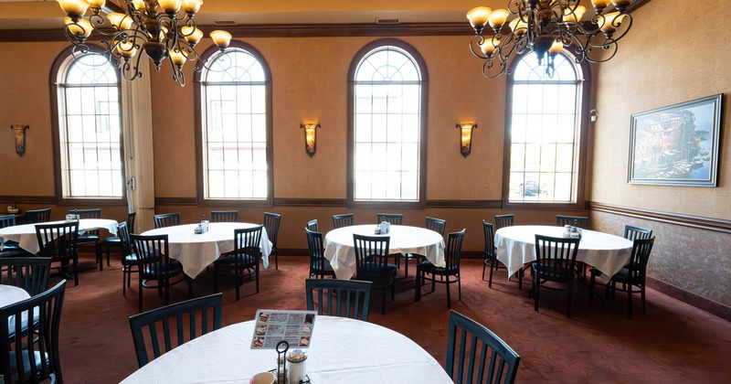 Interior, dining area with big windows in the back