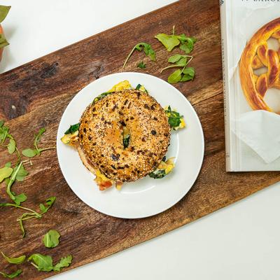 Bagel with Eggs, Bacon & Spinach.