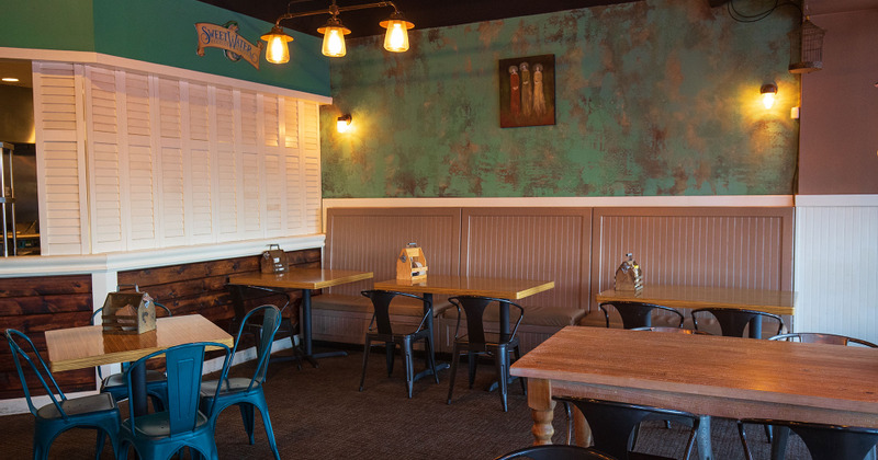 Interior, tables set and cleaned, ready for guests