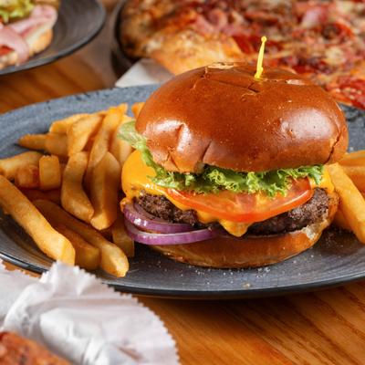 Big Joe Classic Burger served on a plate with fries.