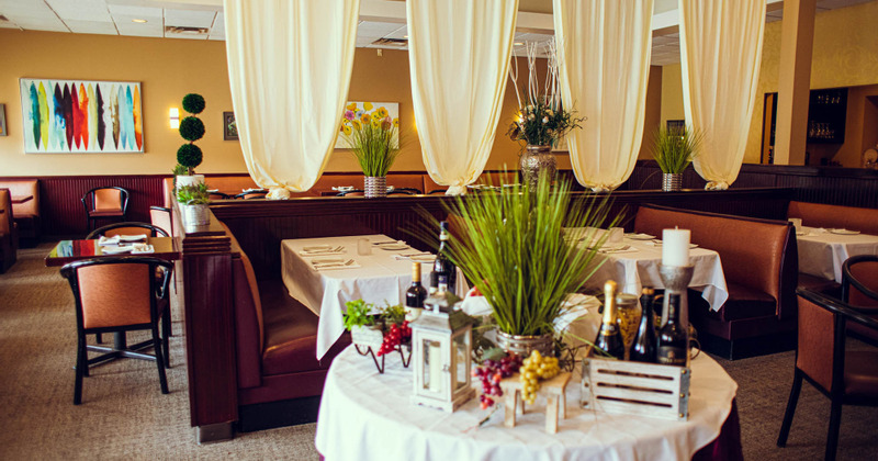 Interior, seating area with wall decorations, tables and benches