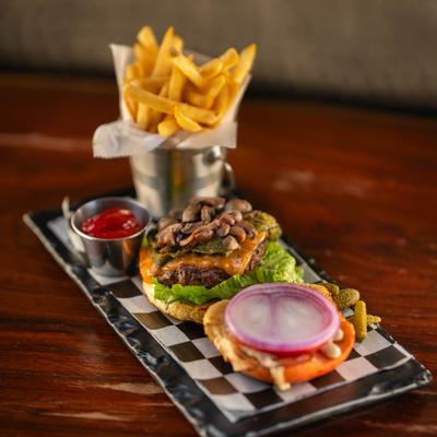 Mushroom cheeseburger and fries.