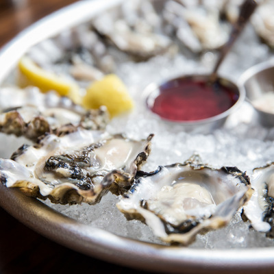 close up view of oysters displayed in ice and ready to be eaten