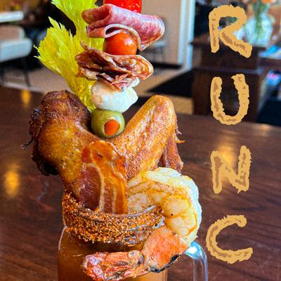 Shrimp cocktail, with chicken wing, bacon, and meat and cheese skewer.