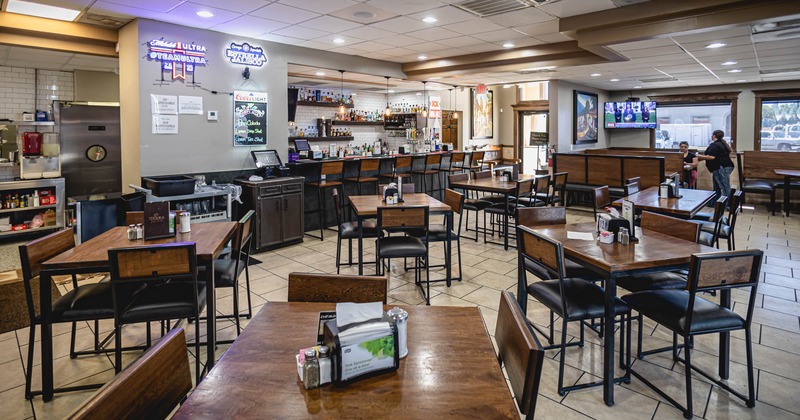 Interior, dining tables and seating, the bar, guests in a booth