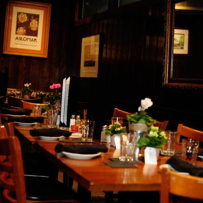 Table set with plates, napkins, glasses and decorations.