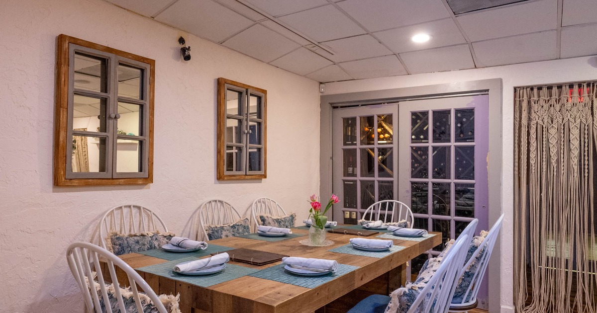 Interior seating area,  chairs and table for six people