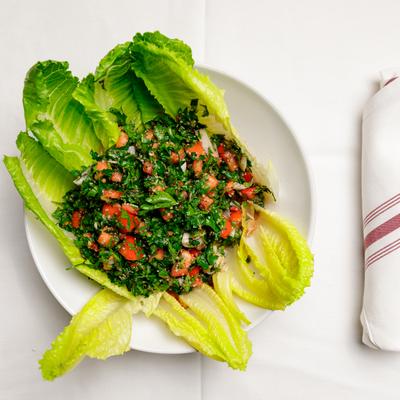 Tabouleh over romaine lettuce leaves.