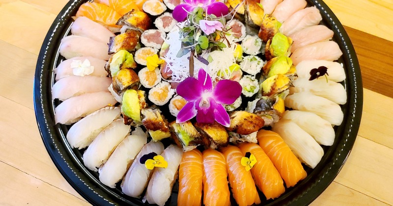 Large sushi platter arranged with assorted sashimi