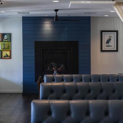 Booth tables by the fireplace.