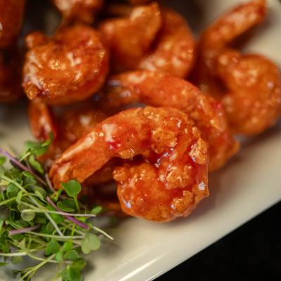 Fried shrimp tossed in a sweet and spicy sauce.