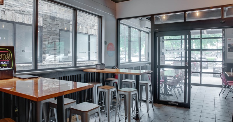 Interior, seating area, high seating tables with stools, tile flooring