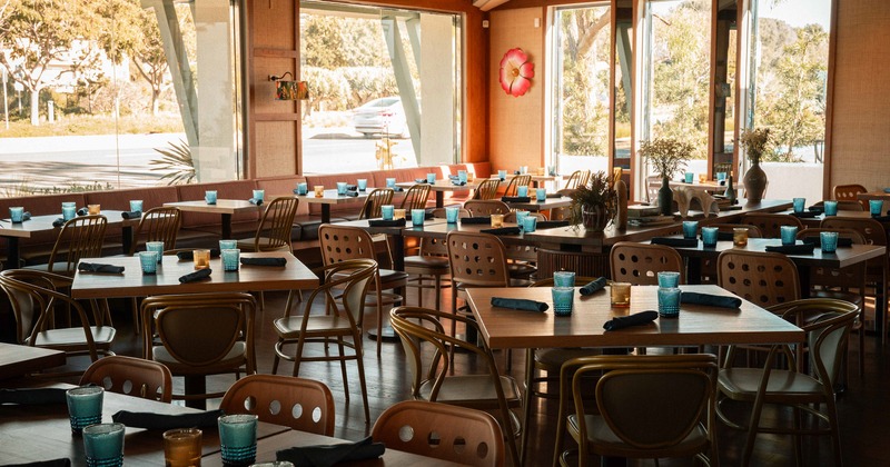Spacious and cozy interior dining area with set dining tables