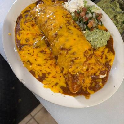 Smothered burrito topped with melted cheese, served guacamole and sour creme.