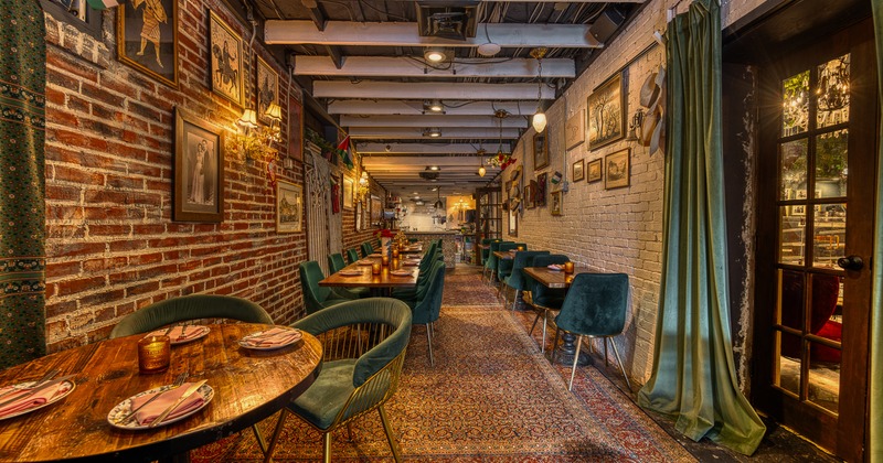 Cozy and stylish restaurant interior with a long, narrow dining area
