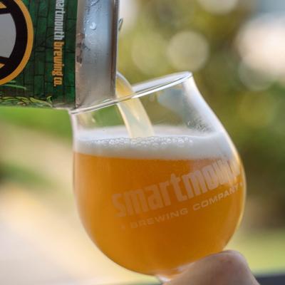 Pouring beer from the can, closeup.