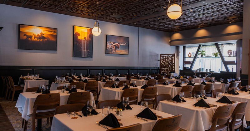 Interior seating area with chairs and tables ready for guests