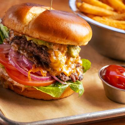 Cali classic cheeseburger served with fries and ketchup.