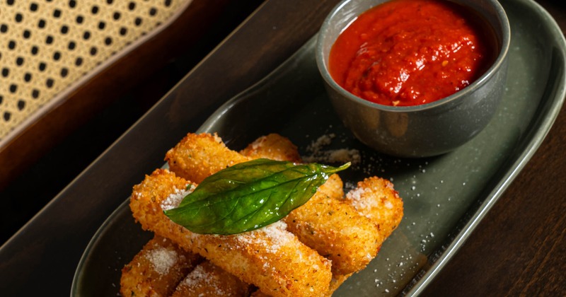 Cheese sticks served with homemade marinara