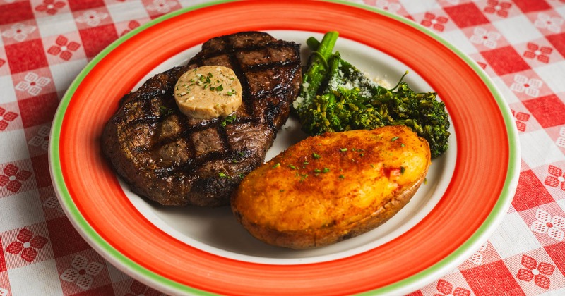 Grilled ribeye, with baked potato and broccolini