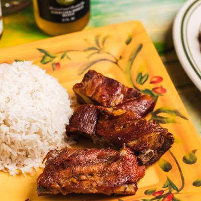 Pork ribs served with rice, close-up.