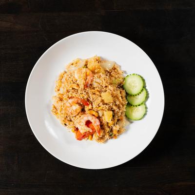 Stir fried rice with shrimp, eggs, garlic, pineapple, cashew nuts, onions, tomato and scallions.
