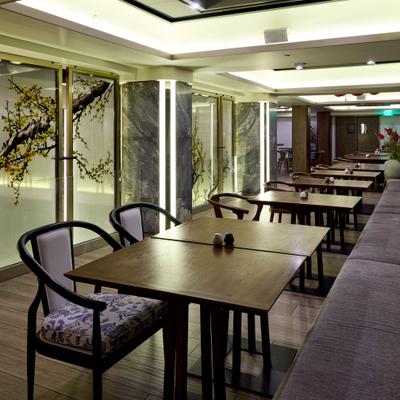 Calm, elegant restaurant with wooden tables and chairs, artistic floral wall panels, soft lighting.