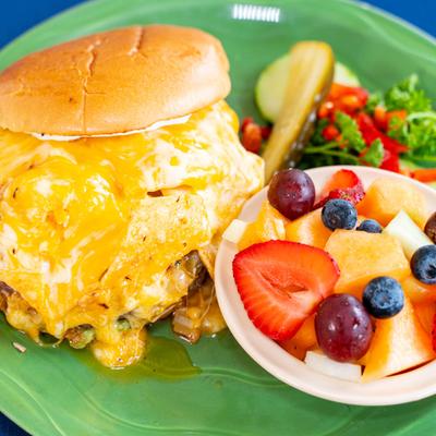 Nacho Burger, and a bowl of fruit.