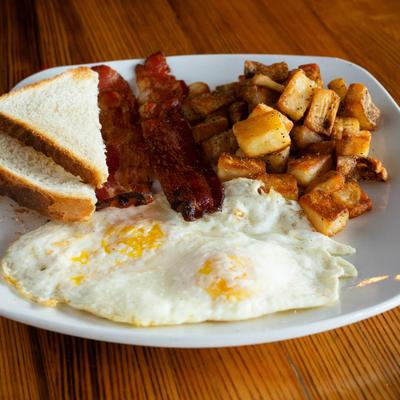 Eggs, Bacon, breakfast potatoes, and toast.