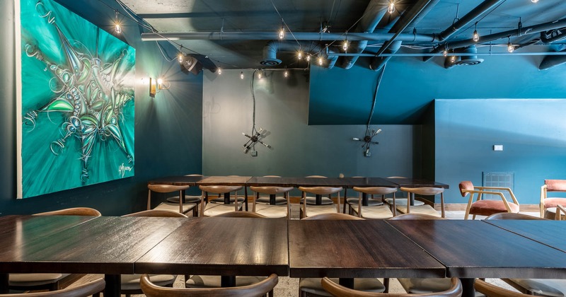 Exterior, patio, seating area, parasols, wooden railing, restaurant shop window on the left
