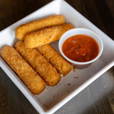 Mozzarella Sticks served with a dipping sauce on the side.