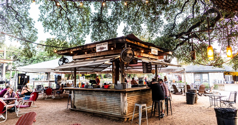 The exterior patio under a large tree