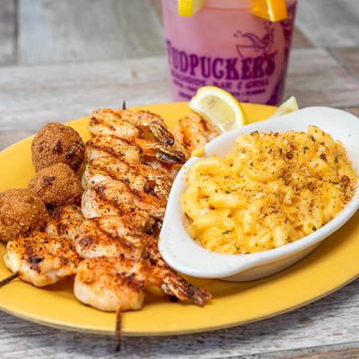 Char-grilled shrimp with hush puppies and mac n cheese.