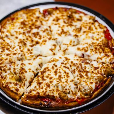 Personal flatbread pizza with your choice of up to four toppings.