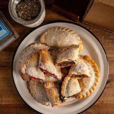 A plate of dessert empanadas.
