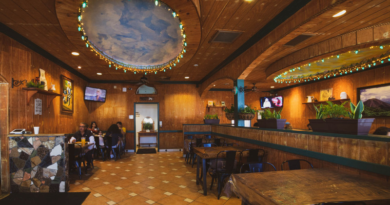 Interior, bar and seating area, guests having fun