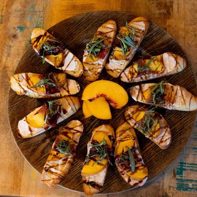 Specialty Seasonal Peach Crostini appetizer for private event.