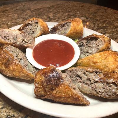 Cheesesteak Egg Roll served with smoked tomato jam.