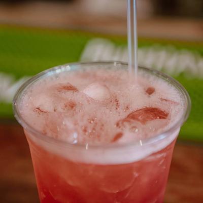 Red cocktail drink, closeup.