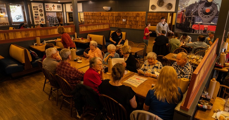 Interior, dining aera with leather booths, tables and chairs