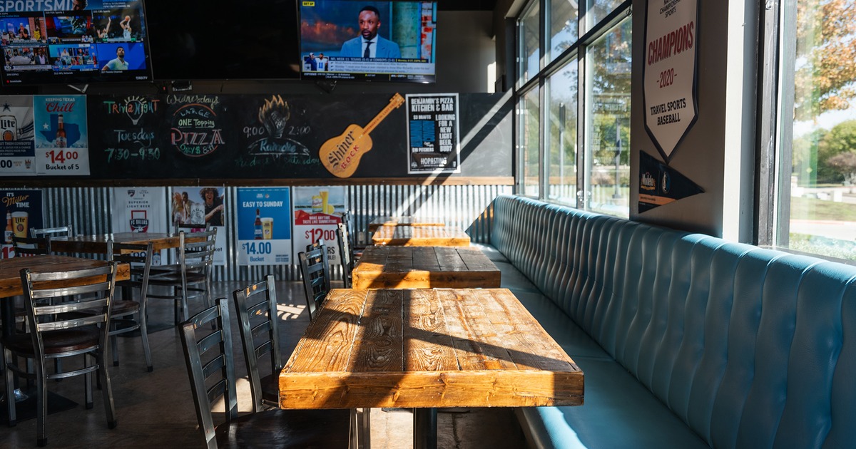 Interior space, upholstered seating and lined-up tables