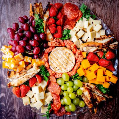 Meat, cheese, and fruit platter.