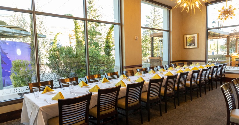 Interior, long dining table set for an event